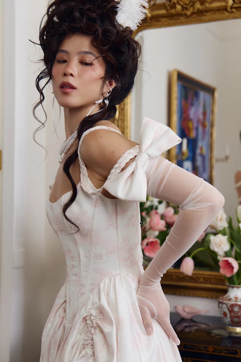 Ivory opera glove side view with sheer mesh sleeve along the forearm and satin bow