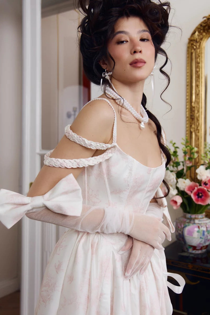 Ivory opera glove close-up on the satin bow and sheer mesh texture at the upper arm