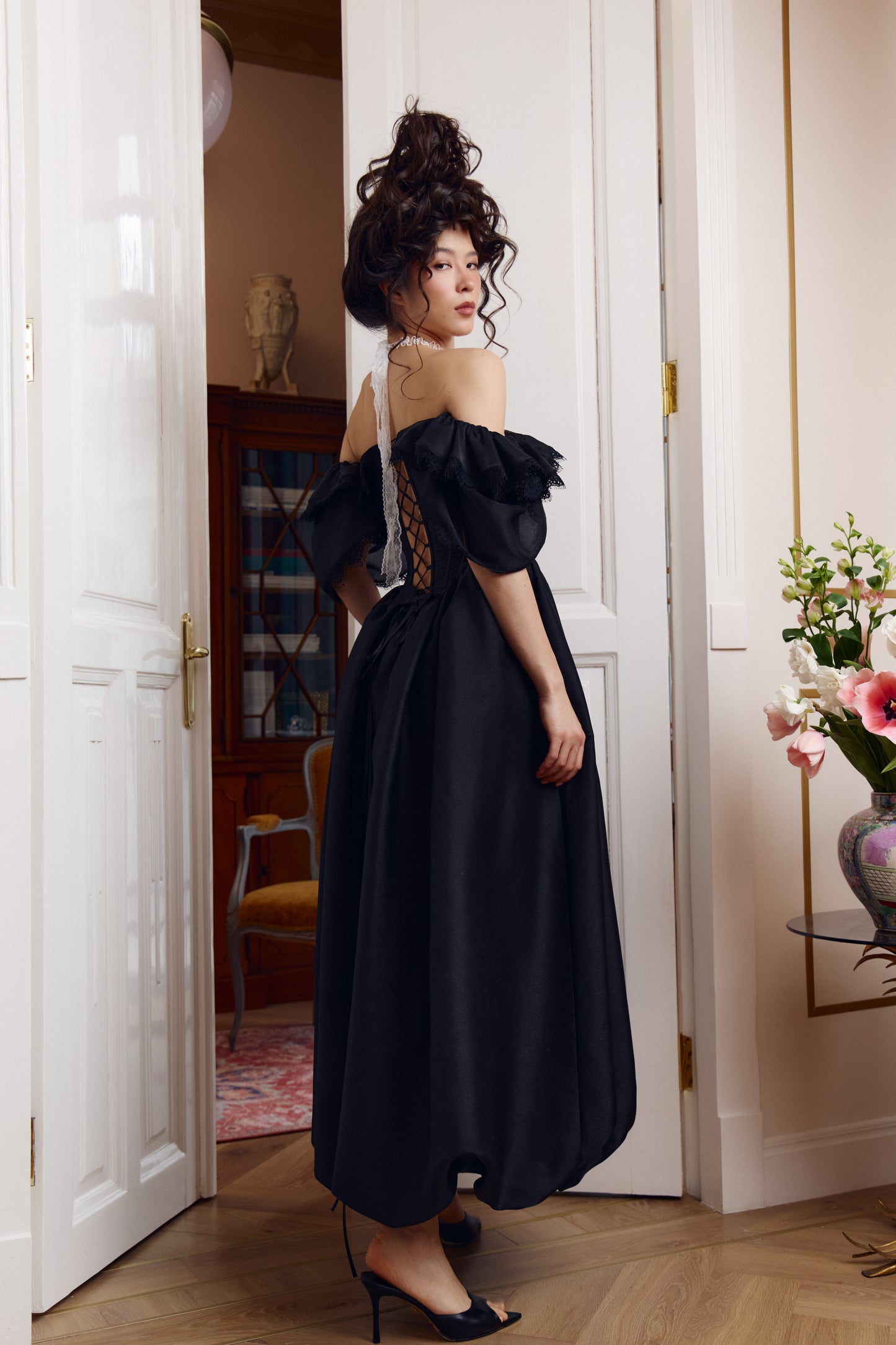 Romantic black gown with voluminous lace sleeves