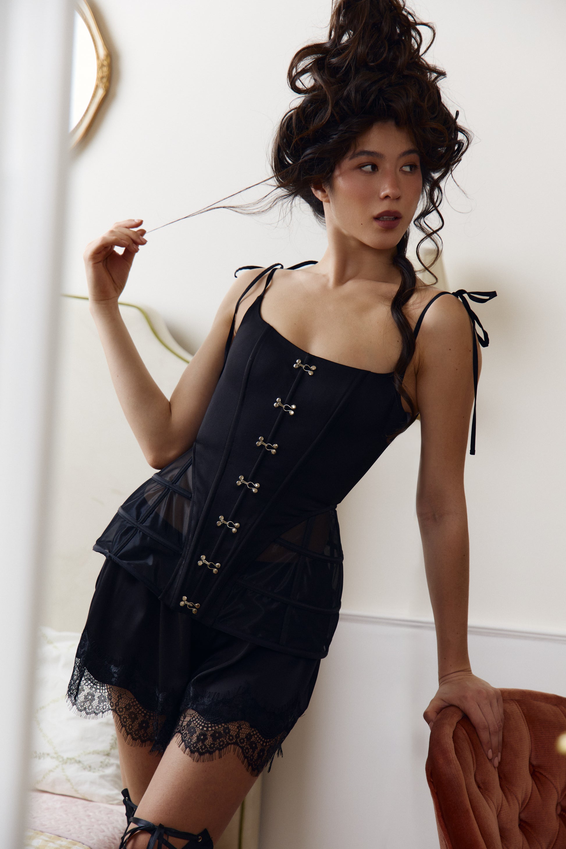 Elegant black satin corset with peplum detail