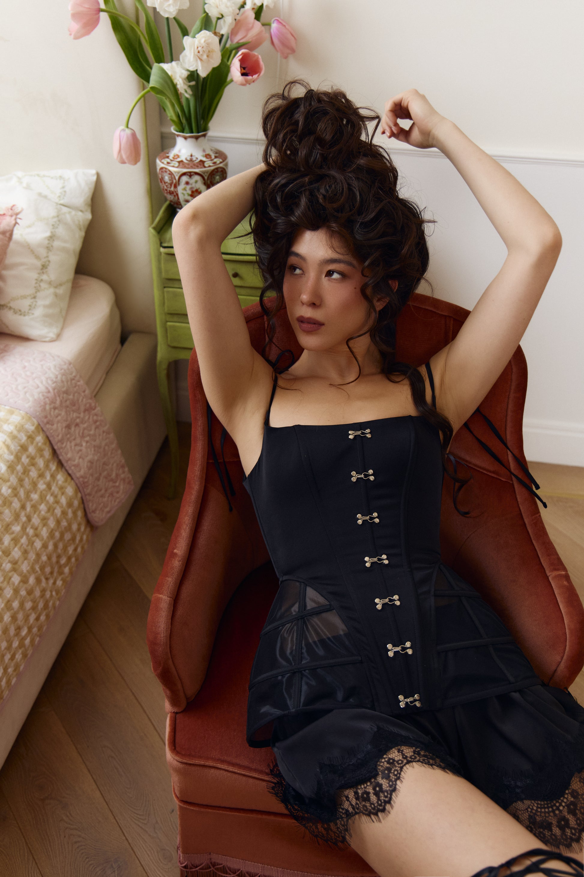 Black satin corset with waist-defining silhouette