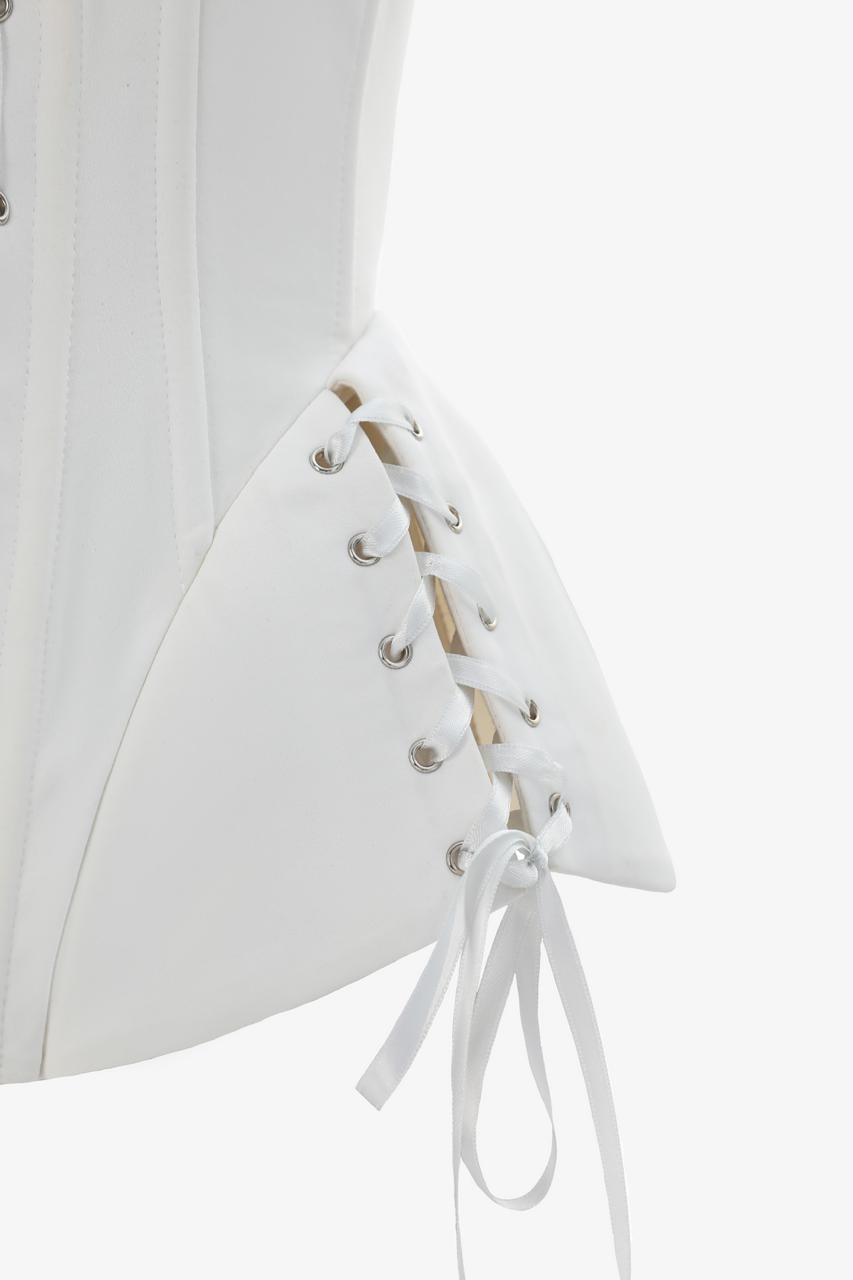 Luxury ivory corset with tailored peplum close binding view