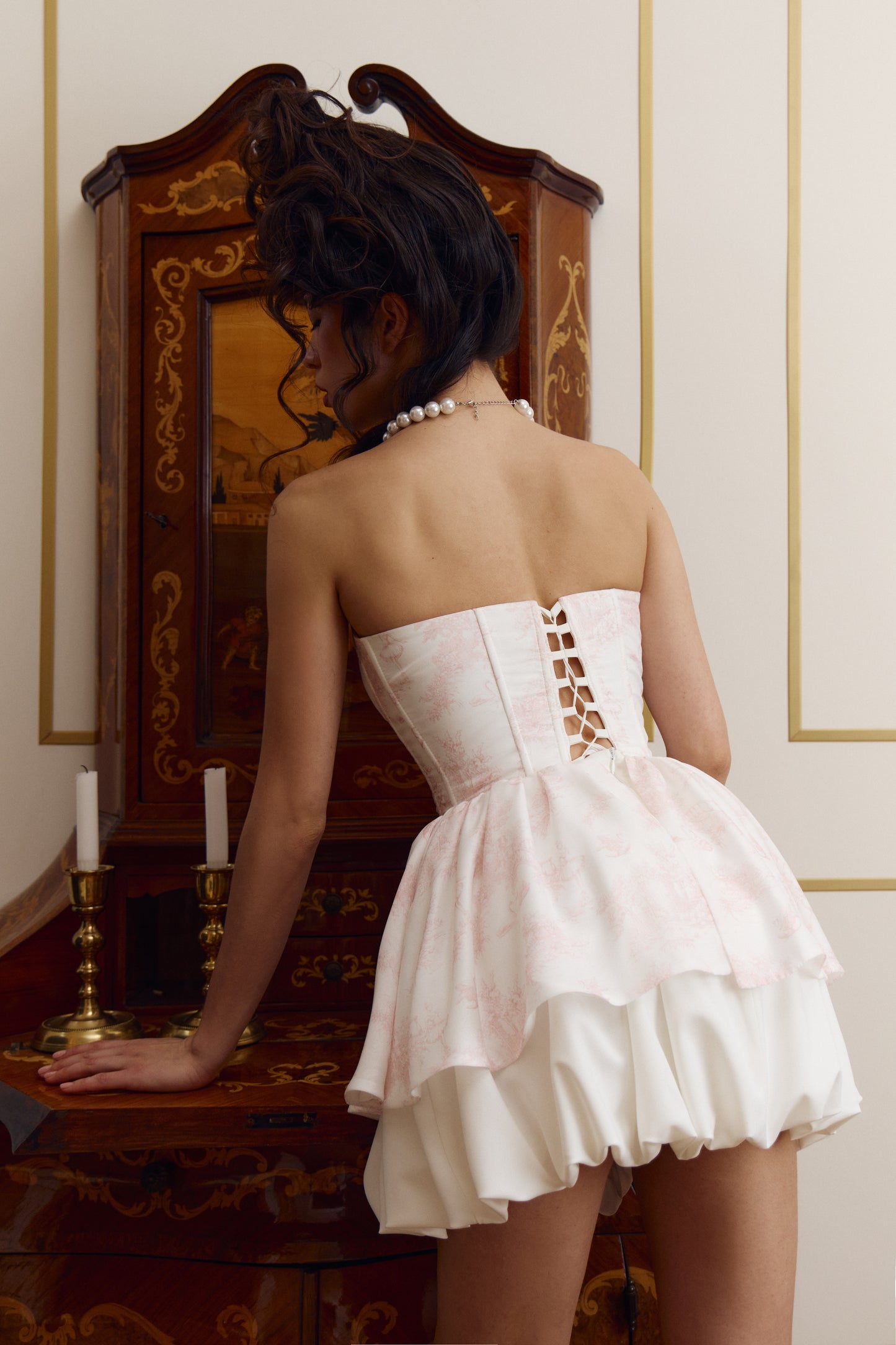 Petit corset and mini skirt set in ivory from back